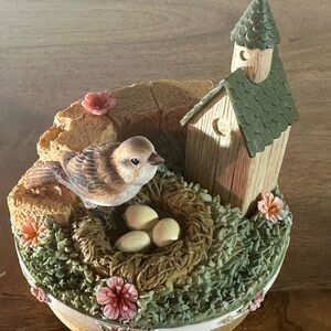 Our America Candle topper featuring a House & Sparrow nesting with three eggs